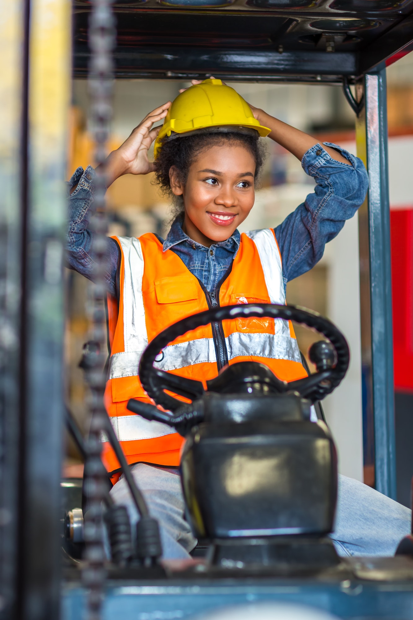women worker at forklift driver happy working in industry factory logistic ship